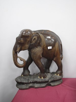 Lot 1404 - A mid-20th century carved hardwood figure of a...