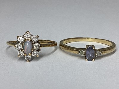Lot 44 - A Dainty 9ct Gold Three Stone Ring, between...