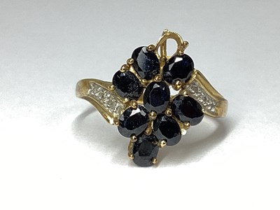Lot 54 - A Claw Set Twist Style Dress Ring, the oval...