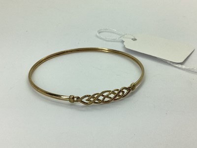 Lot 80 - A 9ct Gold Celtic Style Bangle, of openwork...