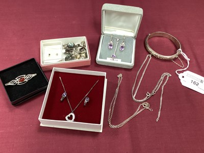 Lot 162 - A Hallmarked Silver Hinged Bangle, E H,...