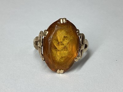 Lot 64 - A Large Oval Claw Set Dress Ring, the faceted...