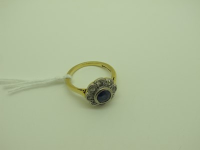 Lot 256 - An 18ct Gold Sapphire and Diamond Cluster Ring,...