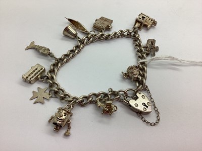 Lot 79 - A Curb Link Charm Bracelet, to hallmarked...
