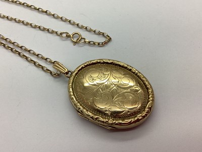 Lot 92 - A 9ct Gold Oval Locket Pendant, leaf scroll...