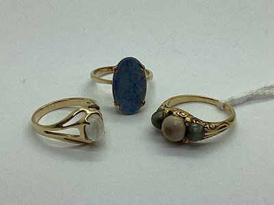 Lot 97 - An Opal (Triplet) Oval Panel Ring, four claw...