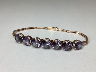 Lot 170 - A Vintage Synthetic Alexandrite Seven Stone...