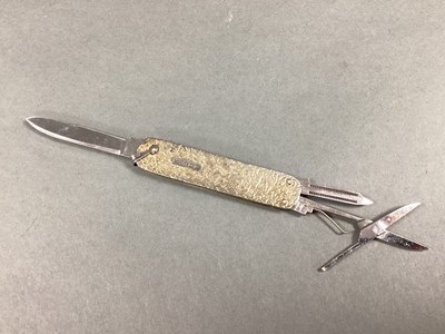 Lot 228 - A Combination Folding Pocket Knife, with brass...