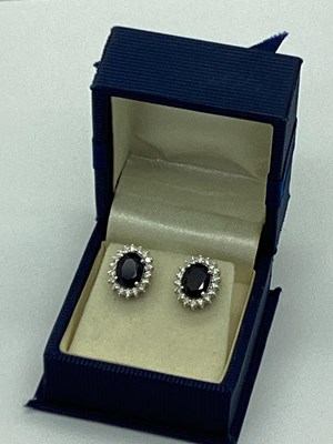 Lot 64 - A Pair of Modern Sapphire and Diamond Cluster...