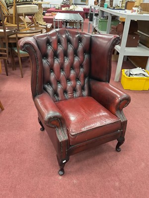 Lot 1481 - Oxblood Leather Button Back Wing Arm Chair,...