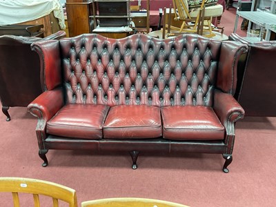 Lot 1478 - Oxblood Leather Button Back Wing Arm Three...
