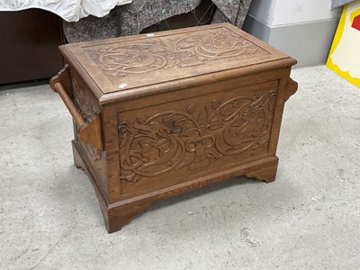 Lot 1457 - XX Century Oak Log Bin, with carved dragons to...