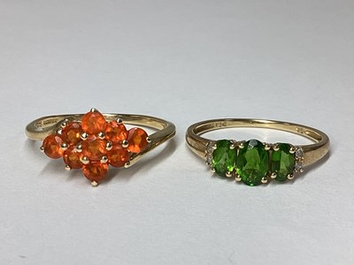 Lot 20 - QVC; A 9ct Gold Claw Set Cluster Ring, between...