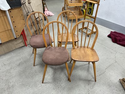 Lot 1447 - Ercol - Set of four lightwood hoop and rail...