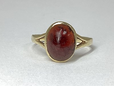 Lot 13 - A 9ct gold Stone Set Ring, oval cabochon set,...