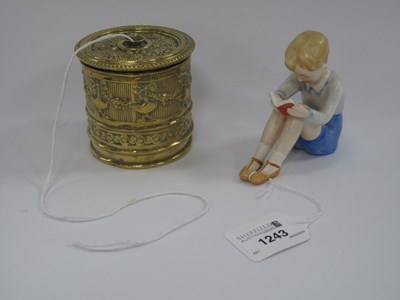 Lot 1243 - Goebel Seated Boy Reading Figure, 8.5cm high,...