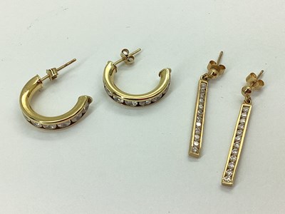 Lot 64 - A Pair of Channel Set Bar Earrings,...