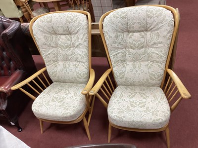 Lot 1487 - A Pair of Ercol Armchairs, with rail backs, on...