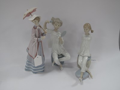Lot 1219 - Lladro Figurines - Lady with swivel parasol,...