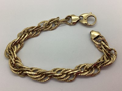 Lot 149 - A Modern Fancy Link Bracelet, hollow textured...