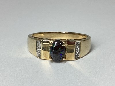 Lot 199 - A Modern 9ct Gold Dress Ring, oval cabochon...
