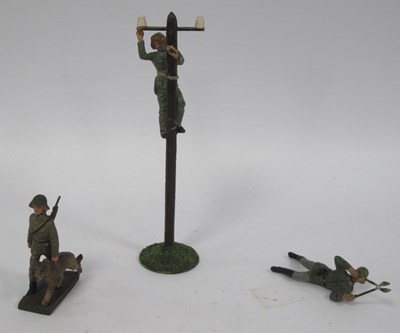Lot 355 - Three Elastolin figures, one laying down with...