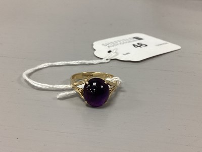 Lot 46 - A Cabochon Set Ring, four claw set, between...
