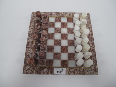 Lot 1387 - A hand-carved marble/alabaster chess set with...