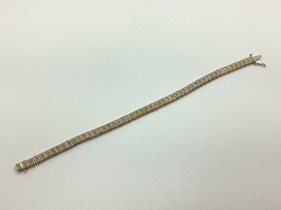 Lot 69 - A Modern Bi-Colour Panel Style Bracelet,...