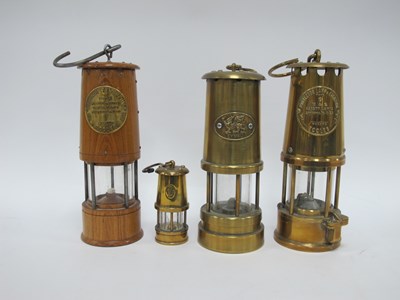Lot 1406 - Four brass miners lamps, including two brass...
