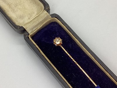 Lot 132 - A Single Stone Cognac Diamond Stick Pin, eight...