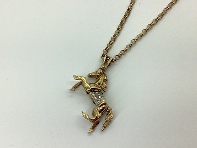 Lot 79 - A 9ct Gold Rearing Horse Articulated Pendant,...