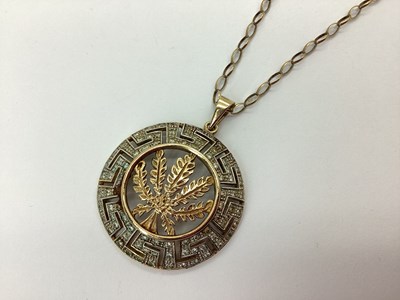 Lot 78 - A Large 9ct Gold Leaf Pendant, within Greek...