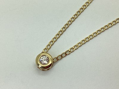 Lot 76 - A Modern Single Stone Pendant, rubover set...