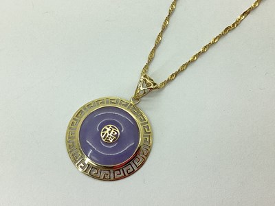 Lot 80 - A Modern Lavender Jade Disc Pendant, within...