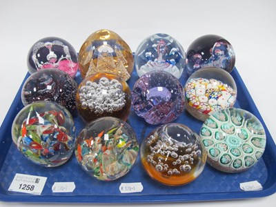 Lot 1258 - Twelve art glass paperweights, in various...