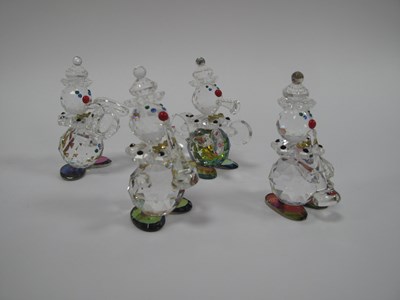 Lot 1307 - A set of four GIS crystal clown band figurines,...