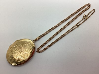 Lot 97 - A 9ct Gold Large Oval Locket Pendant, foliate...