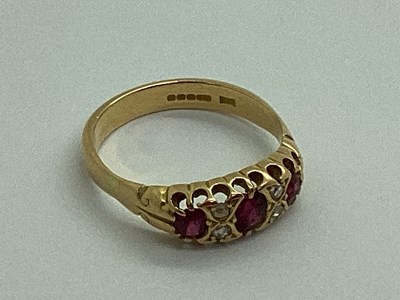 Lot 197 - An 18ct Gold Ruby and Diamond Ring, graduated...