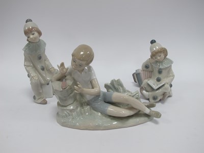 Lot 1282 - Lladro Clowns (2) and Reclining Boy with small...